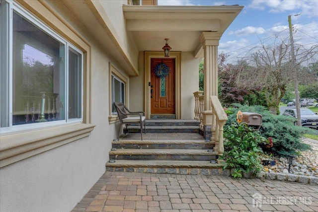12 Euclid Rd, South Amboy, NJ 08879 - view of exterior entry with stucco siding