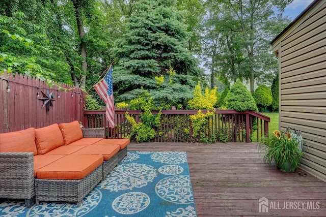 12 Euclid Rd, South Amboy, NJ 08879 - wooden deck featuring an outdoor hangout area and view of wooded area