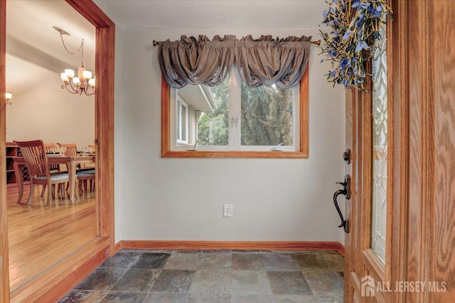 12 Euclid Rd, South Amboy, NJ 08879 - foyer featuring stone finish flooring and a chandelier
