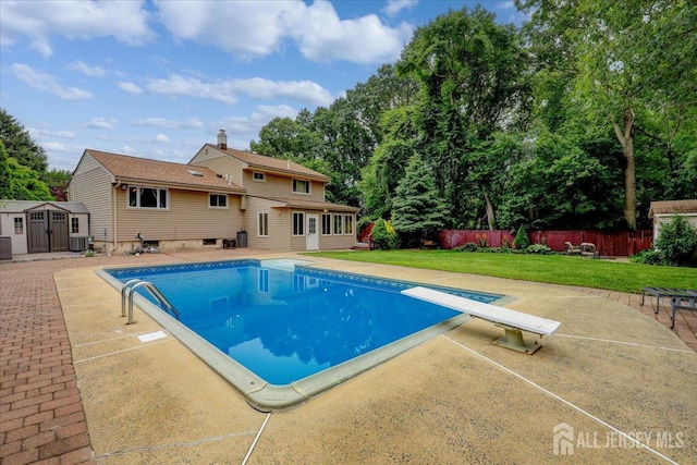 12 Euclid Rd, South Amboy, NJ 08879 - view of pool featuring a shed, a patio area, and a diving board