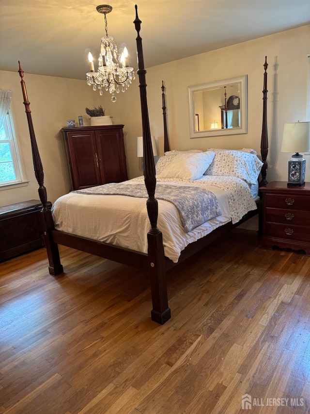 13 Concord St, Edison, NJ 08820 - bedroom featuring wood finished floors and a chandelier