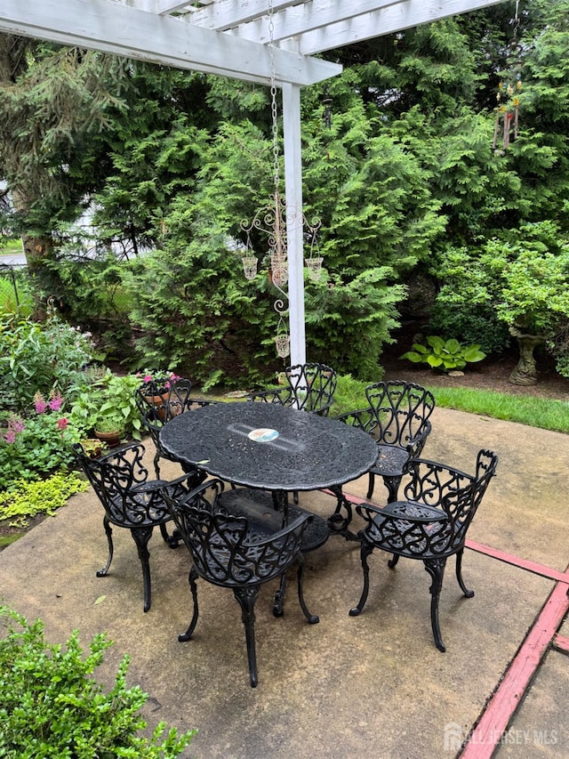 13 Concord St, Edison, NJ 08820 - view of patio / terrace featuring outdoor dining area and a pergola