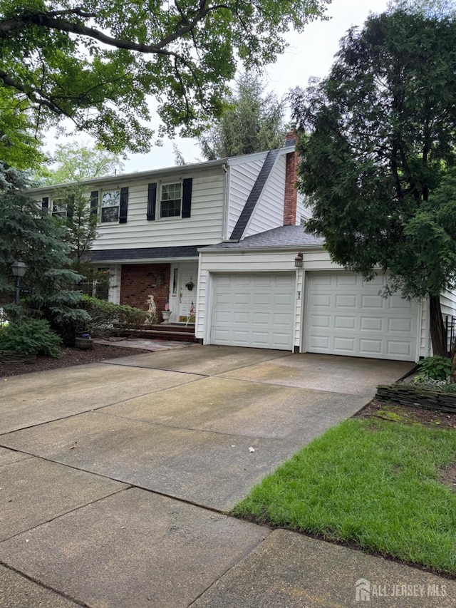 13 Concord St, Edison, NJ 08820 - traditional home featuring driveway, an attached garage, and a chimney