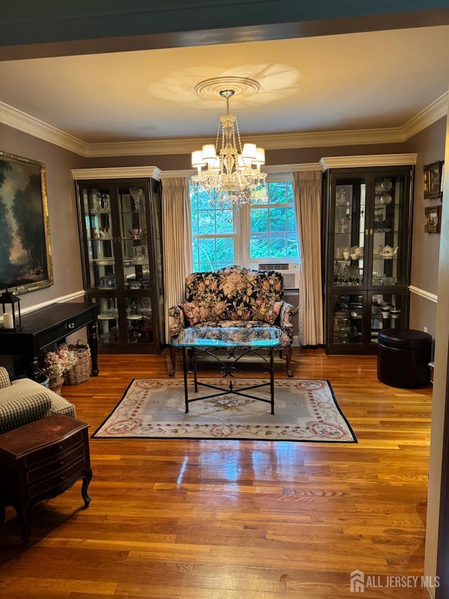 13 Concord St, Edison, NJ 08820 - living room featuring ornamental molding, a chandelier, and wood finished floors