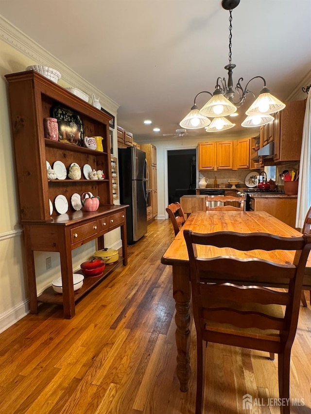 13 Concord St, Edison, NJ 08820 - dining space with ornamental molding, light wood-style flooring, recessed lighting, and a chandelier