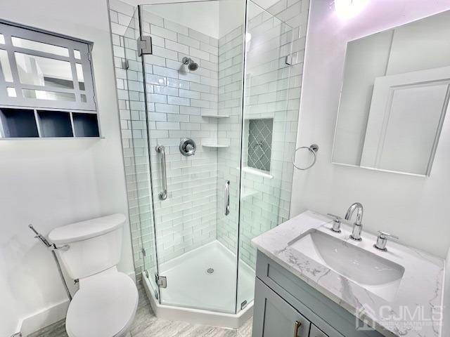 9 Melrose Ave, Sayreville, NJ 08879 - bathroom with vanity, toilet, and a stall shower