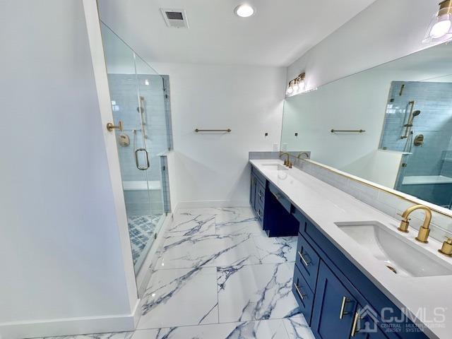9 Melrose Ave, Sayreville, NJ 08879 - bathroom with a shower stall, a sink, visible vents, and double vanity
