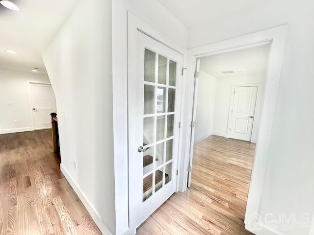 9 Melrose Ave, Sayreville, NJ 08879 - corridor featuring baseboards and wood finished floors
