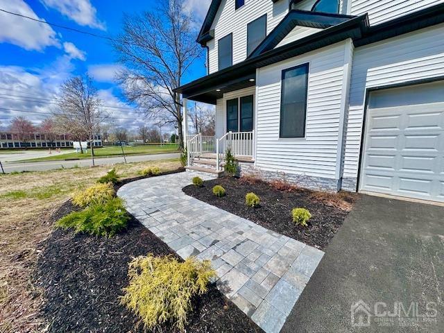 9 Melrose Ave, Sayreville, NJ 08879 - doorway to property with a porch