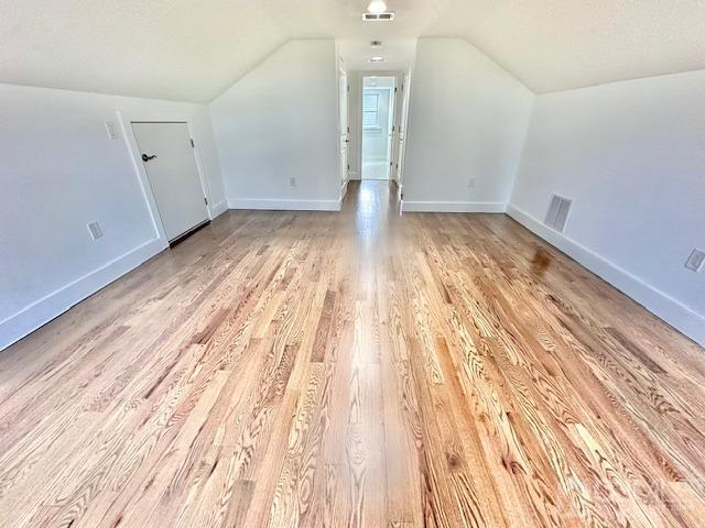 9 Melrose Ave, Sayreville, NJ 08879 - bonus room featuring vaulted ceiling, light wood finished floors, visible vents, and baseboards