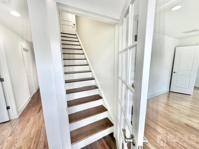 9 Melrose Ave, Sayreville, NJ 08879 - stairs with recessed lighting, wood finished floors, and baseboards