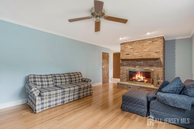 318 Ambrose Ave, Middlesex, NJ 08846 - living room featuring wood finished floors, a fireplace, a ceiling fan, and ornamental molding