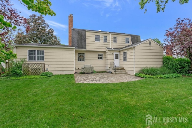 318 Ambrose Ave, Middlesex, NJ 08846 - back of property featuring a patio, entry steps, a chimney, and a yard
