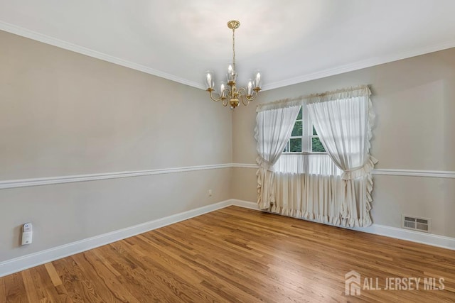 318 Ambrose Ave, Middlesex, NJ 08846 - empty room featuring a chandelier, wood finished floors, and crown molding