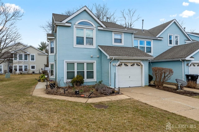 traditional home with roof with shingles, driveway, and a front lawn