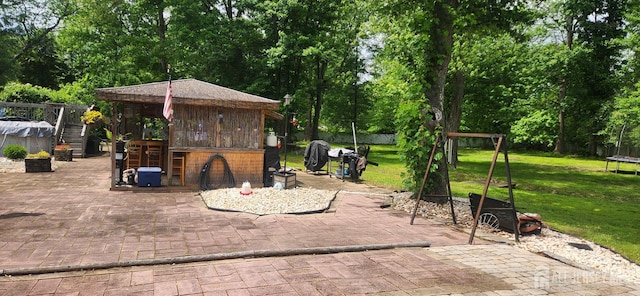 95 Gravel Hill-Spotswood Rd, Monroe, NJ 08831 - view of patio / terrace featuring a trampoline and view of scattered trees