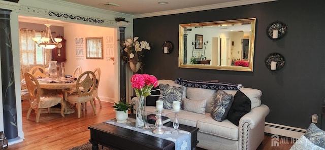 95 Gravel Hill-Spotswood Rd, Monroe, NJ 08831 - living room featuring a baseboard heating unit, a chandelier, wood finished floors, ornamental molding, and baseboards