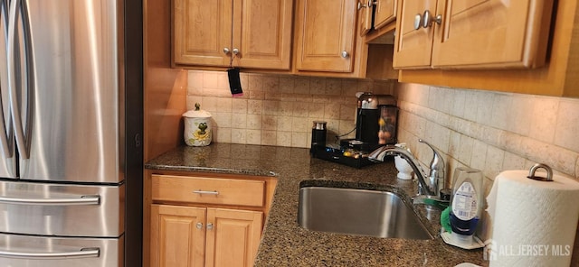 95 Gravel Hill-Spotswood Rd, Monroe, NJ 08831 - kitchen with freestanding refrigerator, a sink, decorative backsplash, brown cabinets, and dark stone countertops