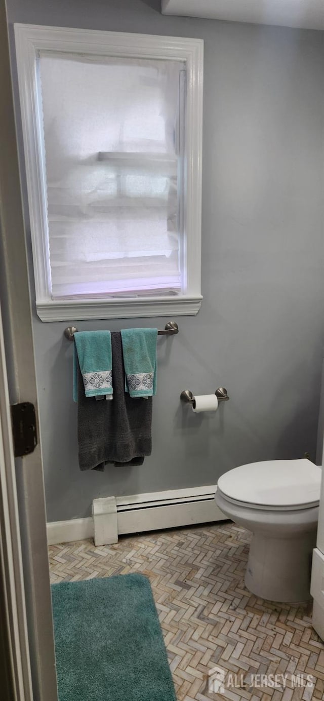 95 Gravel Hill-Spotswood Rd, Monroe, NJ 08831 - bathroom with baseboard heating, toilet, and baseboards