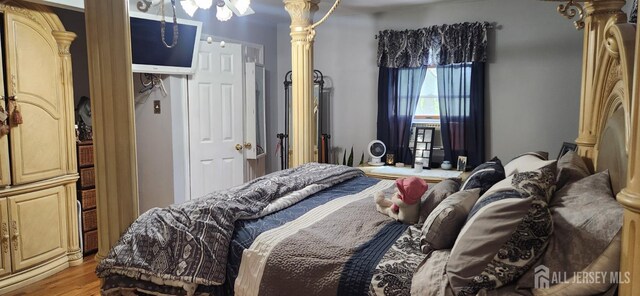 95 Gravel Hill-Spotswood Rd, Monroe, NJ 08831 - bedroom featuring light wood-type flooring and ornate columns