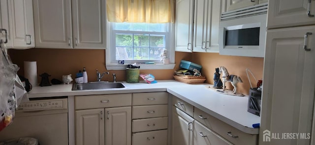 95 Gravel Hill-Spotswood Rd, Monroe, NJ 08831 - kitchen featuring a sink, white microwave, light countertops, and white cabinets