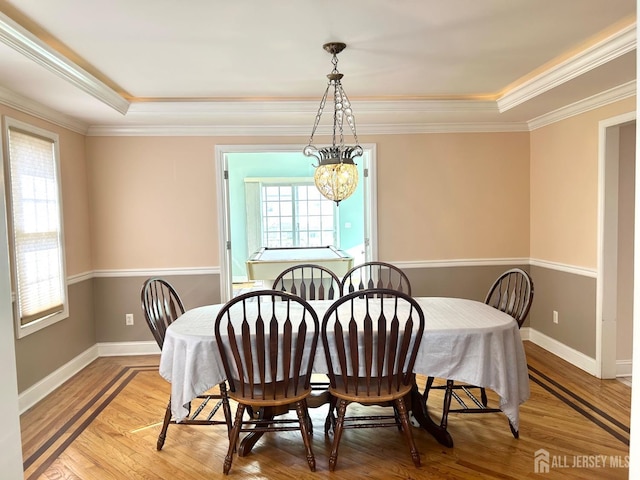 150 Montrose Ave, South Plainfield, NJ 07080 - dining area with wood finished floors, crown molding, and a tray ceiling