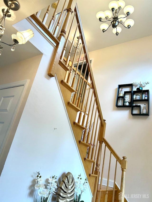 150 Montrose Ave, South Plainfield, NJ 07080 - staircase with a chandelier
