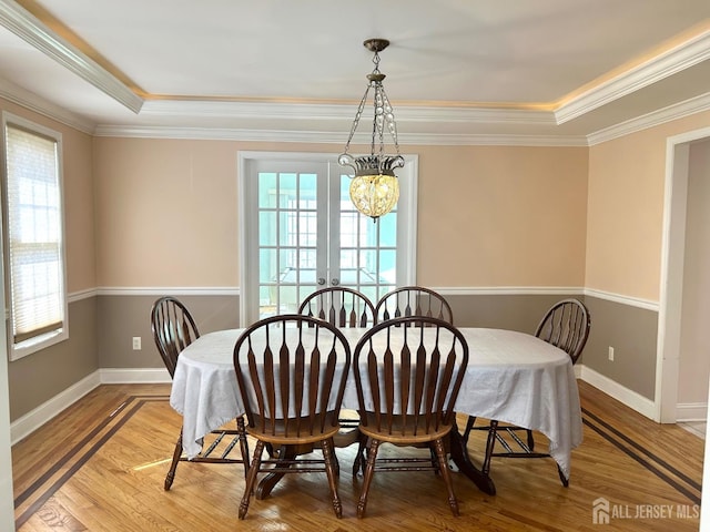 150 Montrose Ave, South Plainfield, NJ 07080 - dining space with healthy amount of natural light, crown molding, light wood finished floors, and french doors