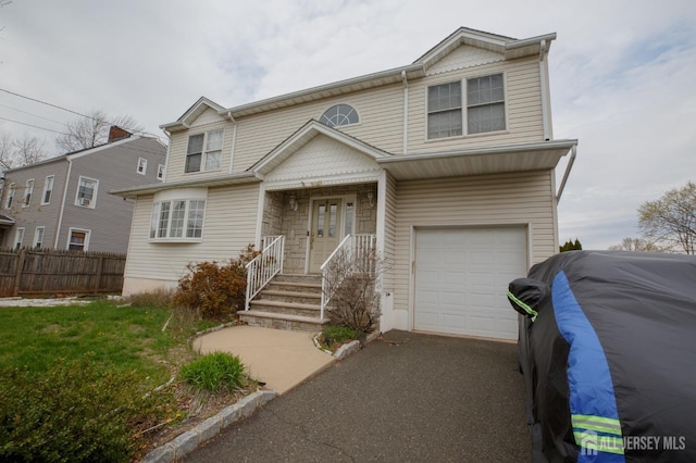 150 Montrose Ave, South Plainfield, NJ 07080 - view of front facade with an attached garage and asphalt driveway