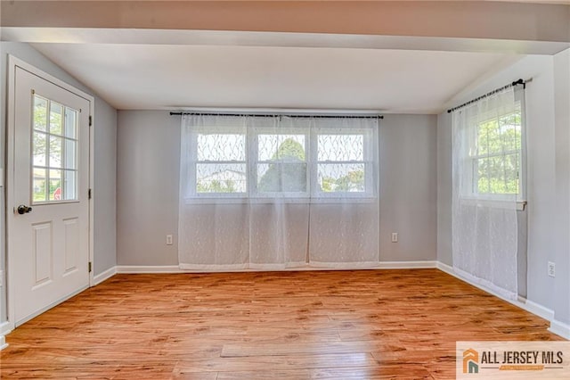 73 Chatham Dr Unit 73A, Monroe, NJ 08831 - spare room featuring light wood-type flooring, lofted ceiling, and baseboards