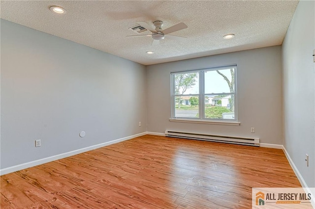 73 Chatham Dr Unit 73A, Monroe, NJ 08831 - spare room with a baseboard radiator, ceiling fan, wood finished floors, a textured ceiling, and baseboards
