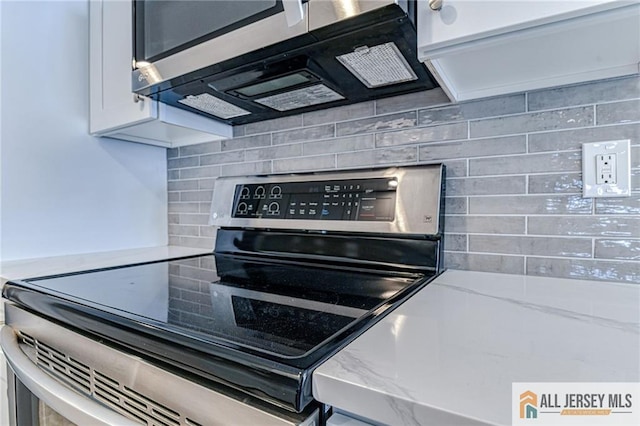 73 Chatham Dr Unit 73A, Monroe, NJ 08831 - kitchen with stainless steel appliances, tasteful backsplash, white cabinets, and light countertops