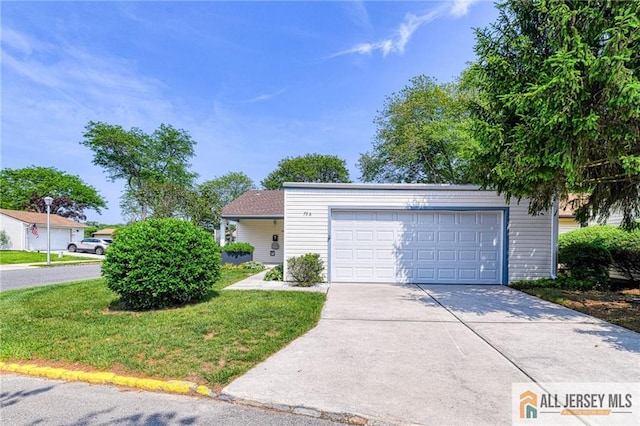 73 Chatham Dr Unit 73A, Monroe, NJ 08831 - view of front facade with concrete driveway, a garage, and a front yard