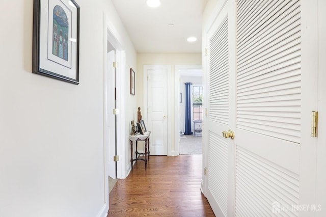 corridor featuring dark hardwood / wood-style flooring