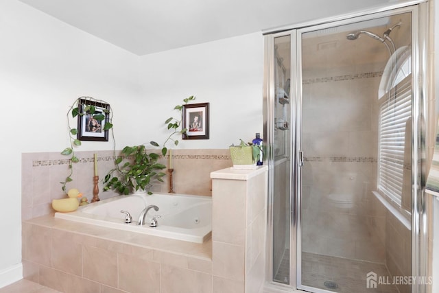 bathroom with independent shower and bath