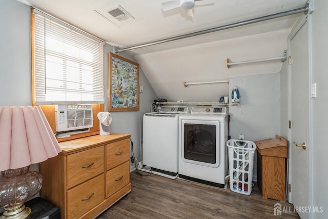 laundry room featuring dark wood-type flooring, separate washer and dryer, and ceiling fan