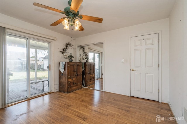 unfurnished room featuring ceiling fan and light hardwood / wood-style flooring