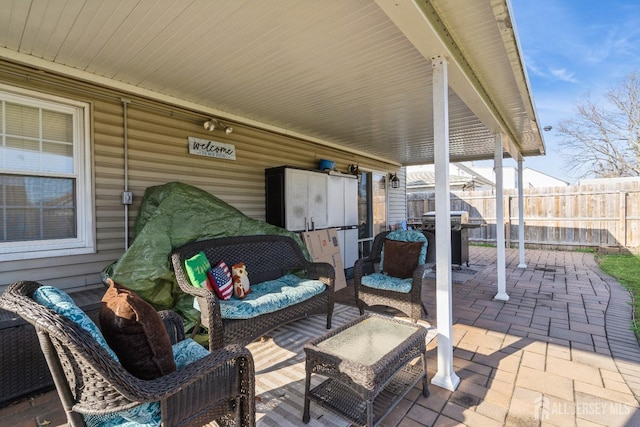 view of patio / terrace featuring an outdoor living space and a grill