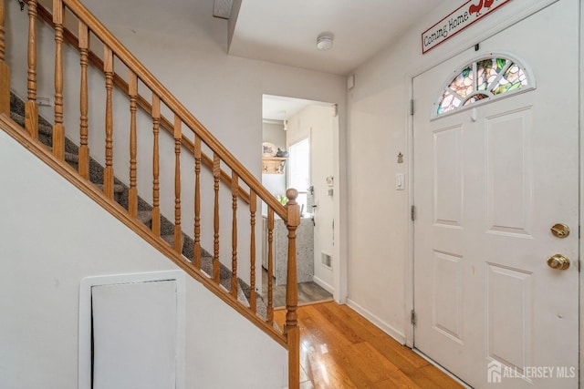 entryway with light hardwood / wood-style flooring