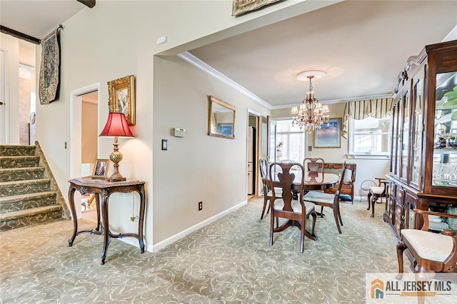 carpeted dining space with crown molding, a chandelier, baseboards, and stairs