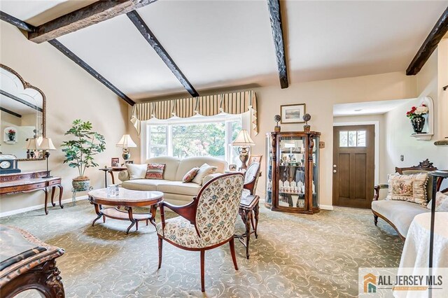 living area featuring carpet floors and baseboards