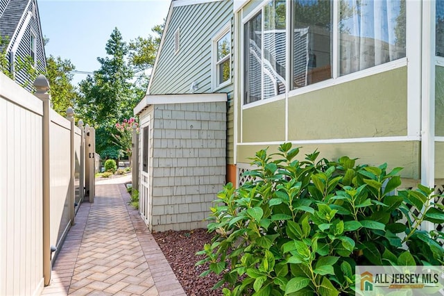 view of side of property with fence