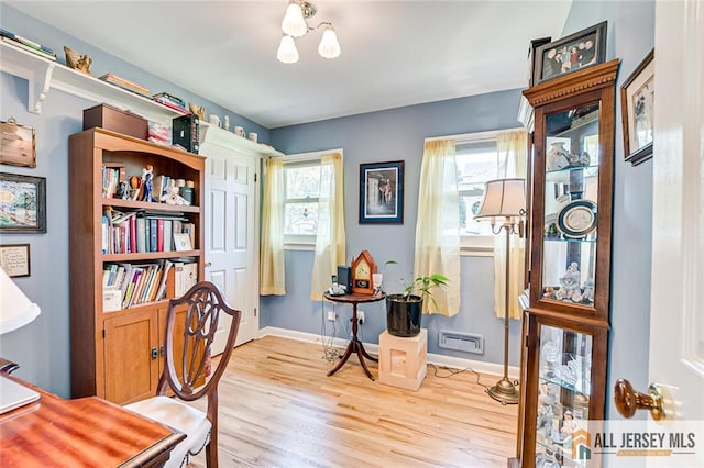 home office featuring light wood finished floors and baseboards