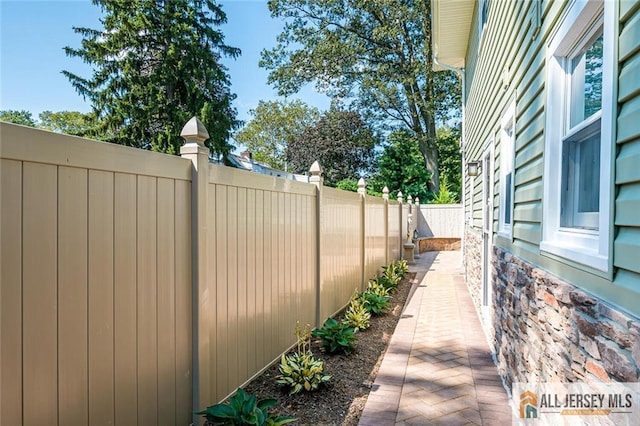 view of property exterior with fence