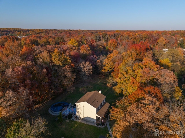 drone / aerial view with a view of trees
