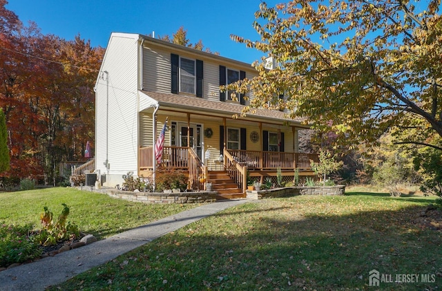 view of front of home featuring covered porch and a front lawn