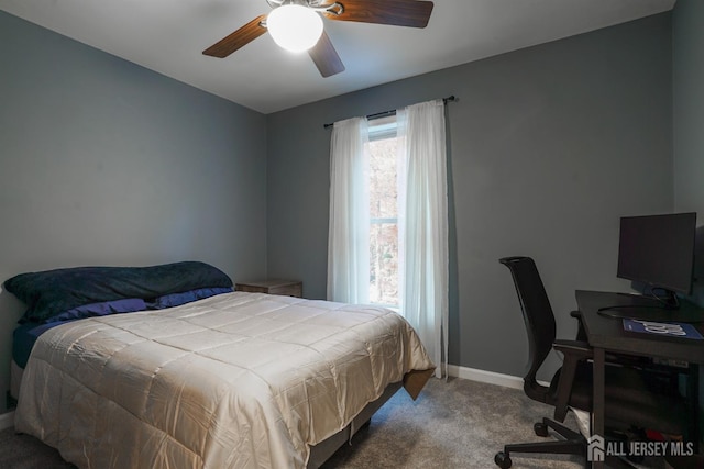 carpeted bedroom featuring baseboards and ceiling fan