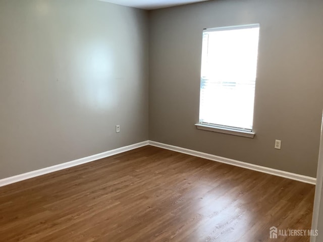 931 Cedar Ct, New Brunswick, NJ 08901 - unfurnished room with dark wood finished floors