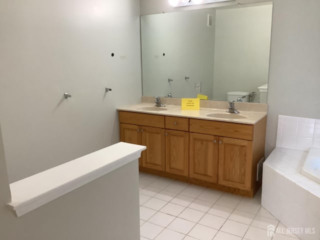 931 Cedar Ct, New Brunswick, NJ 08901 - full bath with a garden tub, double vanity, and tile patterned floors