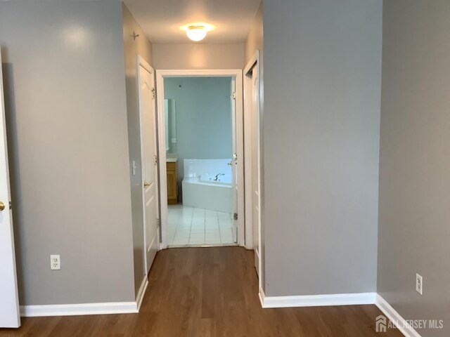 931 Cedar Ct, New Brunswick, NJ 08901 - hall featuring wood finished floors and baseboards